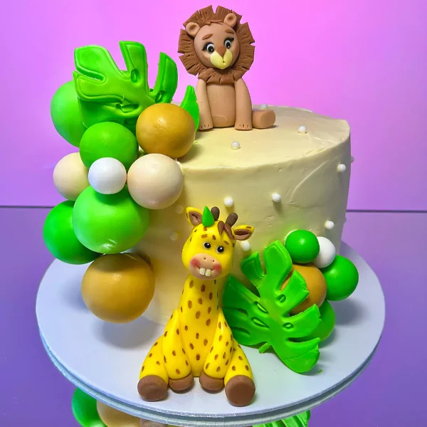 gateau enfant très mignon avec girafe et lion fait par la meilleur pâtisserie a geneve