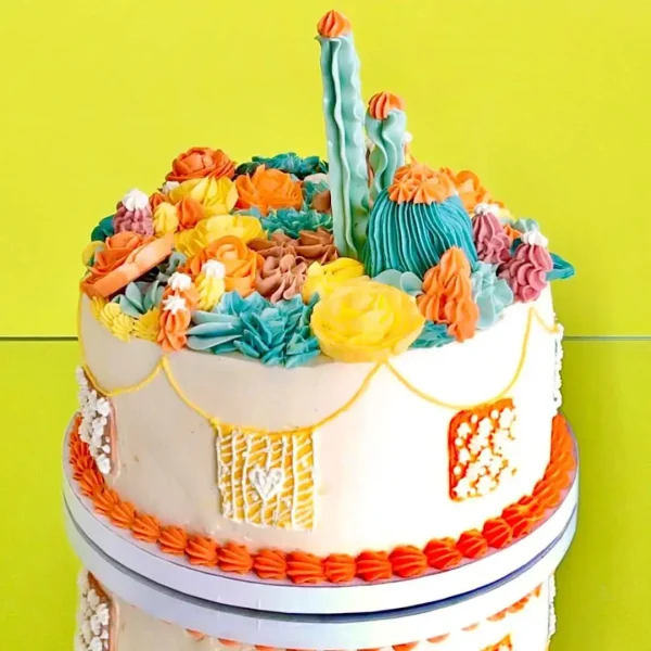 Gâteau Cactus Mexico décoré avec des plantes succulentes et cactus en crème au beurre, idéal pour les fêtes à thème à Genève, Lausanne, Nyon, Vevey, Montreux, et Morges. Une création sur mesure de Natcake.