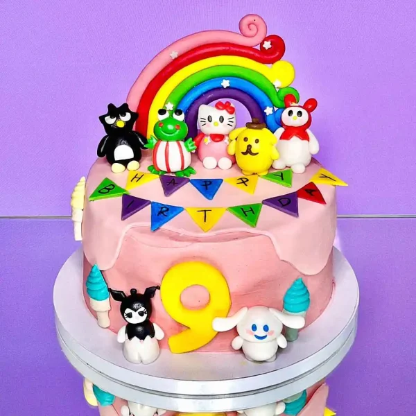 Gâteau Hello Kitty décoré avec des figurines, idéal pour les anniversaires d'enfants et les fêtes à Genève, Lausanne, Nyon, Vevey, Montreux, et Morges. Une création sur mesure de Natcake.